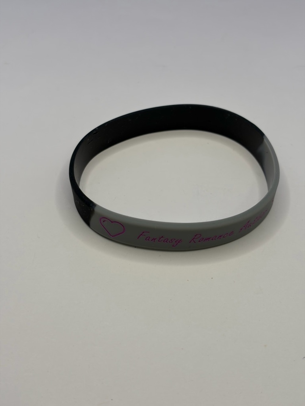 💜 5/$15 - Rebecca Jose Author Black Silicone Wristband - Pink Accent - Picture 4 of 5